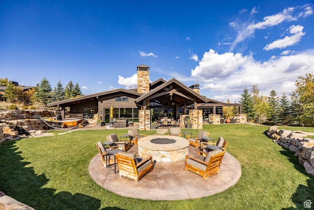 1159 Snow Berry St, Park City, UT 84098 - rear view of property with a patio area, a fire pit, a chimney, and a lawn