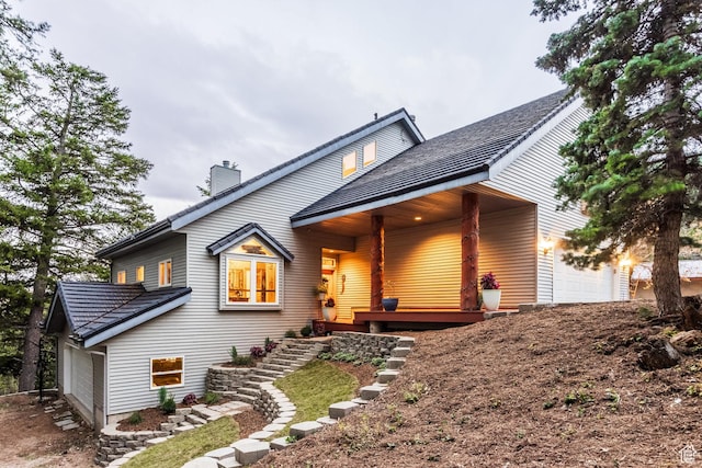 105 Paradise Rd, Summit Park, UT 84098 - view of front of house with a garage and a chimney
