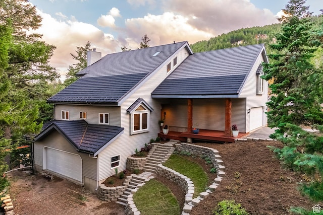105 Paradise Rd, Summit Park, UT 84098 - rear view of house featuring a garage, a chimney, a porch, and stairway