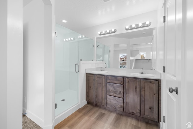 2003 S Freestone Blvd Unit 424, Santaquin, UT 84655 - bathroom with double vanity, a shower stall, and wood finished floors