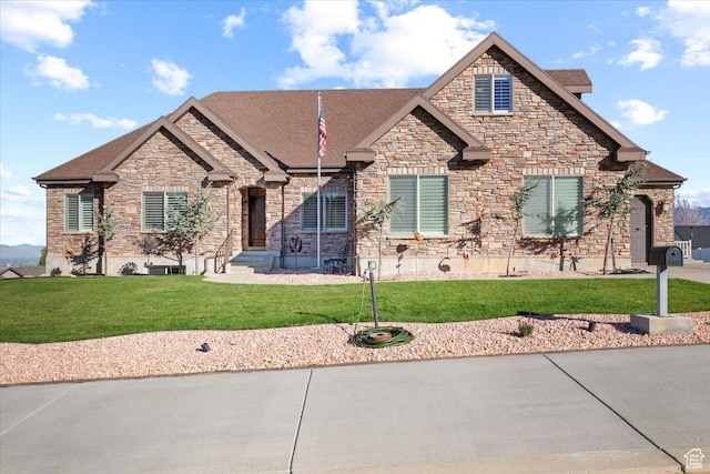 51 E Magellan Ln, Elk Ridge, UT 84651 - view of front facade with stone siding and a front lawn