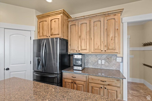 51 E Magellan Ln, Elk Ridge, UT 84651 - kitchen with stainless steel fridge with ice dispenser, decorative backsplash, baseboards, dark stone counters, and light brown cabinets