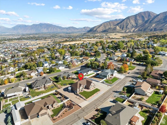51 E Magellan Ln, Elk Ridge, UT 84651 - aerial overview of property's location with nearby suburban area and a mountain backdrop