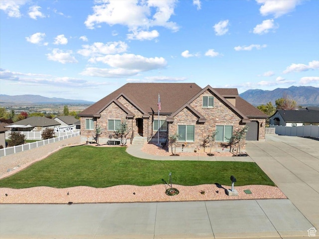 51 E Magellan Ln, Elk Ridge, UT 84651 - craftsman-style home with stone siding, a mountain view, driveway, and roof with shingles