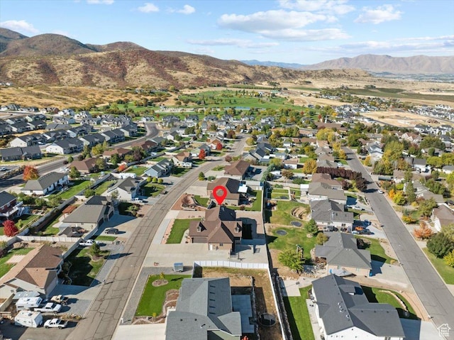 51 E Magellan Ln, Elk Ridge, UT 84651 - aerial overview of property's location with a mountainous background and nearby suburban area