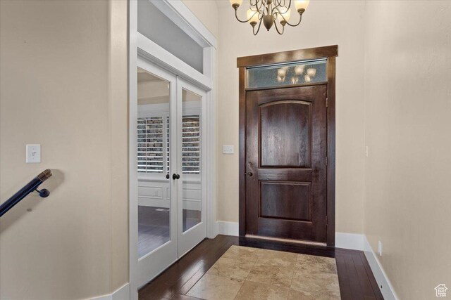 51 E Magellan Ln, Elk Ridge, UT 84651 - foyer entrance featuring a chandelier, french doors, wood-type flooring, and baseboards