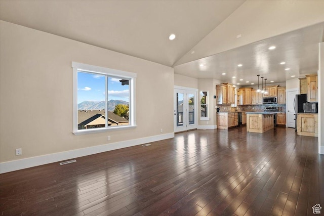 51 E Magellan Ln, Elk Ridge, UT 84651 - unfurnished living room with recessed lighting, dark wood-style flooring, baseboards, and high vaulted ceiling
