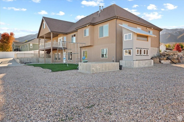 51 E Magellan Ln, Elk Ridge, UT 84651 - back of house with a balcony and a mountain view