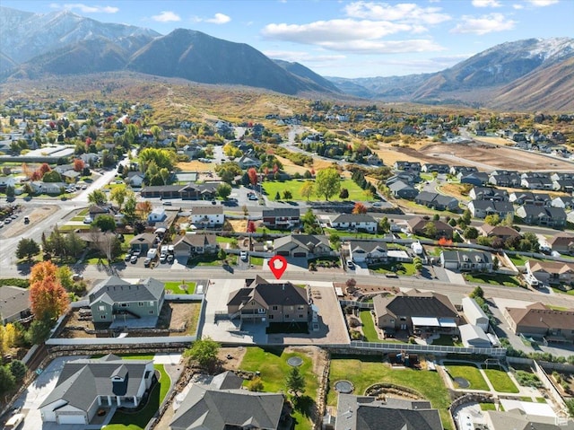 51 E Magellan Ln, Elk Ridge, UT 84651 - aerial view of property and surrounding area featuring nearby suburban area and a mountainous background