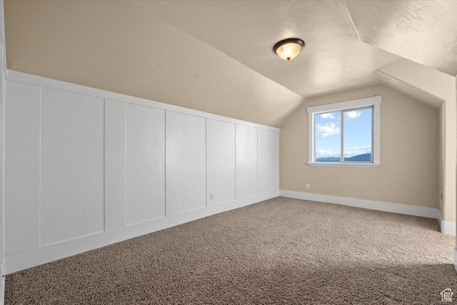 51 E Magellan Ln, Elk Ridge, UT 84651 - bonus room featuring carpet, a decorative wall, and lofted ceiling