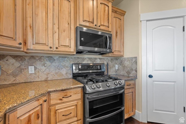 51 E Magellan Ln, Elk Ridge, UT 84651 - kitchen featuring stainless steel appliances, tasteful backsplash, and light stone counters