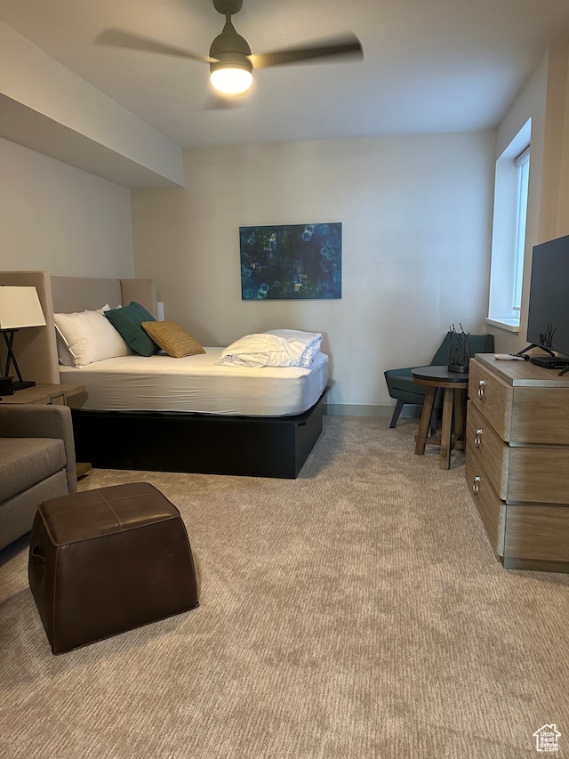 carpeted bedroom featuring ceiling fan