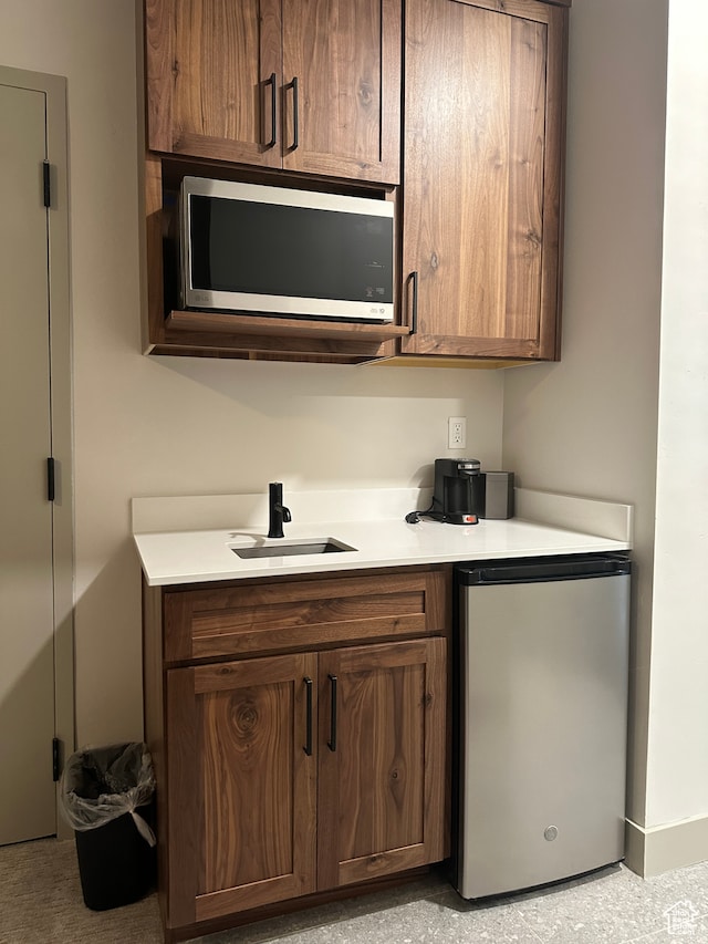kitchen with appliances with stainless steel finishes and sink