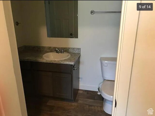 643 N 30 E, Vineyard, UT 84058 - half bathroom with toilet, baseboards, vanity, and wood finished floors