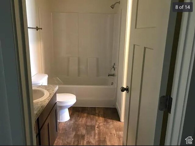 643 N 30 E, Vineyard, UT 84058 - bathroom with vanity, toilet, washtub / shower combination, and wood finished floors