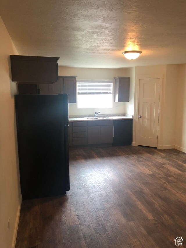 643 N 30 E, Vineyard, UT 84058 - kitchen with freestanding refrigerator, gray cabinetry, dark wood-type flooring, light countertops, and a textured ceiling