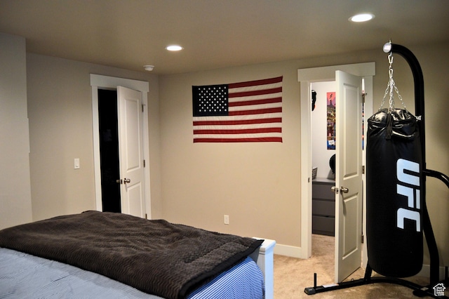 bedroom with recessed lighting, light colored carpet, and baseboards