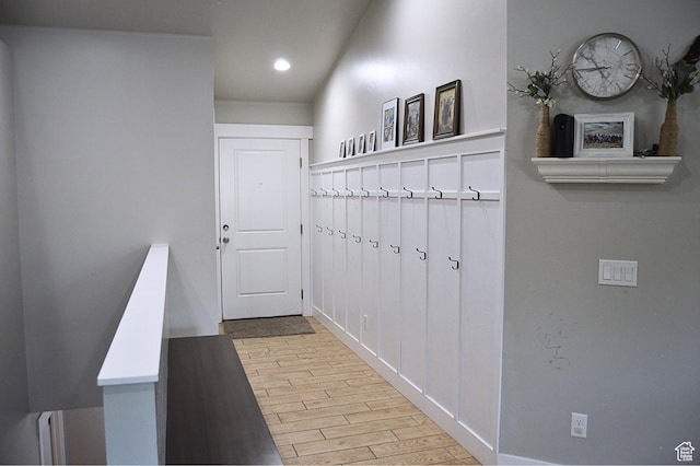 mudroom with recessed lighting, wood finished floors, and baseboards