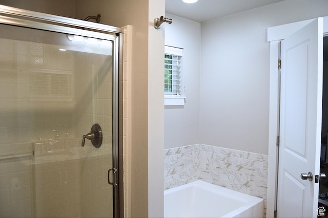 full bath with a shower stall and a bath