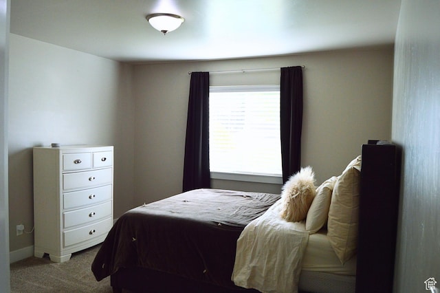 carpeted bedroom with baseboards