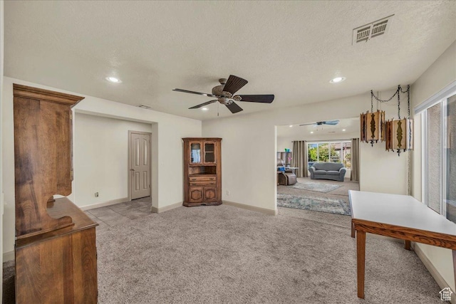 540 E Pintura Dr, Bloomington, UT 84790 - living area featuring light colored carpet, a ceiling fan, a textured ceiling, recessed lighting, and baseboards