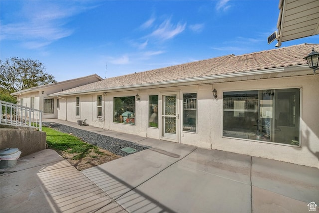 back of house featuring a patio area