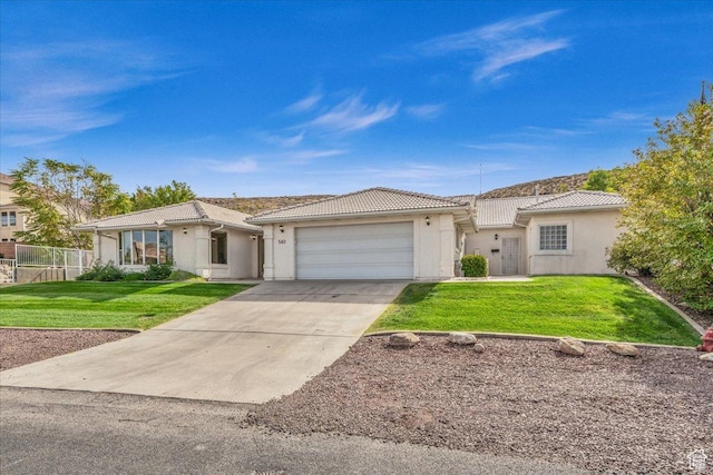 540 E Pintura Dr, Bloomington, UT 84790 - ranch-style home featuring a tile roof, an attached garage, stucco siding, and driveway