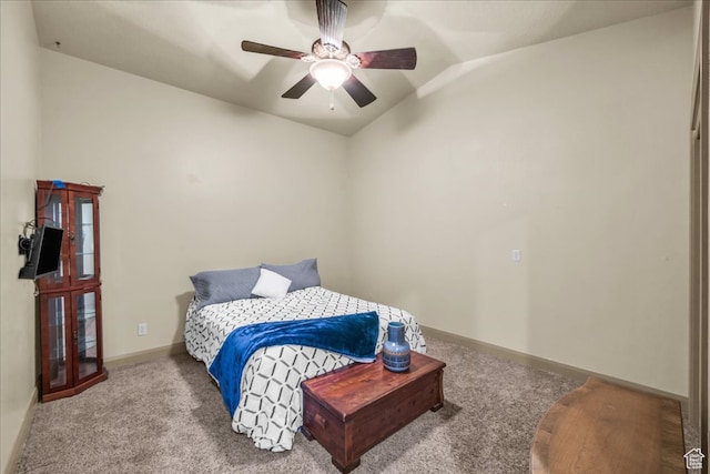 carpeted bedroom with vaulted ceiling and ceiling fan