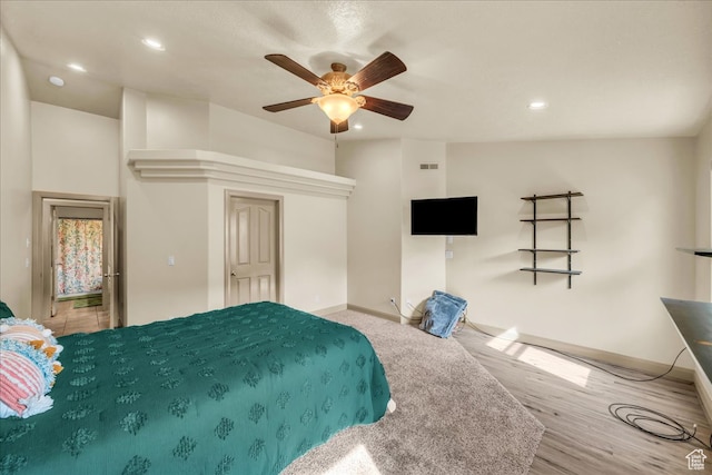 bedroom featuring light wood-type flooring and ceiling fan