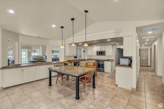 540 E Pintura Dr, Bloomington, UT 84790 - dining space with vaulted ceiling, light tile patterned floors, recessed lighting, and a textured ceiling