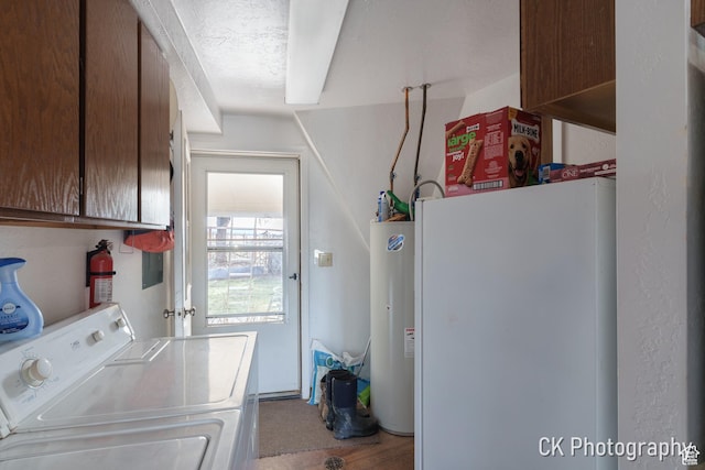 690 E 500 S, Fillmore, UT 84631 - clothes washing area featuring cabinet space, separate washer and dryer, and electric water heater