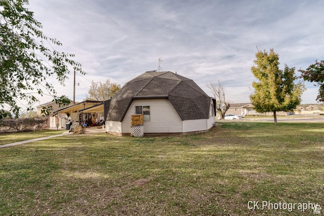 690 E 500 S, Fillmore, UT 84631 - view of side of home with a gambrel roof, roof with shingles, and a yard