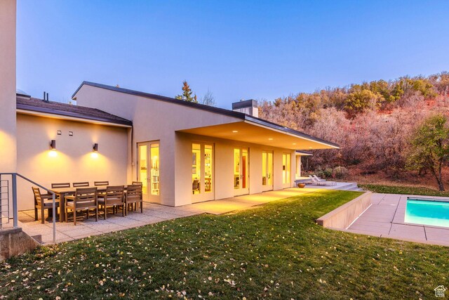 671 N Freeze Creek Cir, Emigration Canyon, UT 84108 - back of house with a patio area, a yard, a chimney, and an outdoor pool