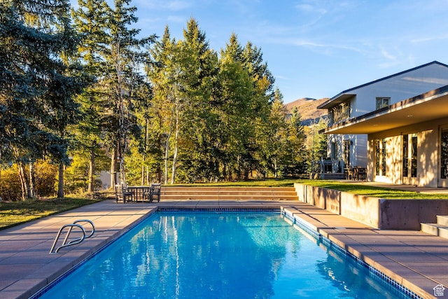 671 N Freeze Creek Cir, Emigration Canyon, UT 84108 - swimming pool featuring a patio area