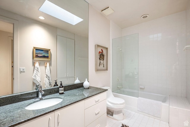 671 N Freeze Creek Cir, Emigration Canyon, UT 84108 - bathroom with a skylight, toilet, tile patterned flooring, vanity, and washtub / shower combination