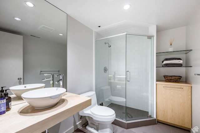 671 N Freeze Creek Cir, Emigration Canyon, UT 84108 - bathroom with a sink, a shower stall, toilet, recessed lighting, and tile patterned flooring