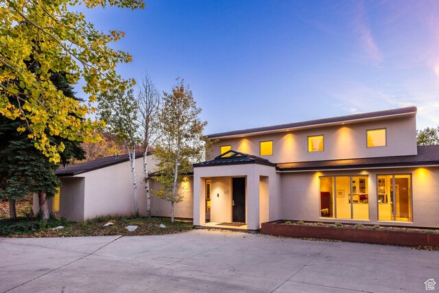 671 N Freeze Creek Cir, Emigration Canyon, UT 84108 - view of front facade featuring stucco siding and a standing seam roof