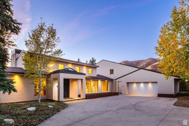 671 N Freeze Creek Cir, Emigration Canyon, UT 84108 - view of front of house with stucco siding and concrete driveway