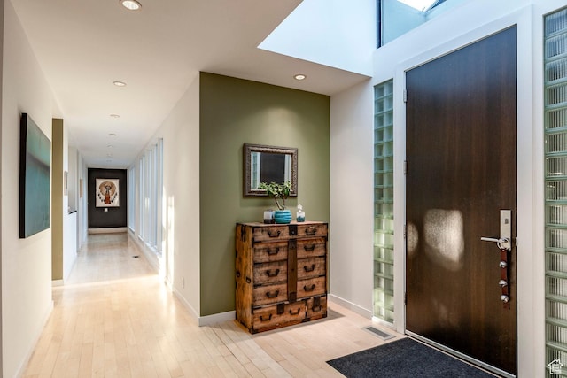 671 N Freeze Creek Cir, Emigration Canyon, UT 84108 - entryway with light wood-style flooring, recessed lighting, baseboards, and a skylight