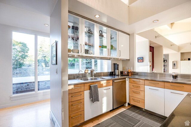 671 N Freeze Creek Cir, Emigration Canyon, UT 84108 - kitchen with stainless steel counters, plenty of natural light, dishwasher, and a sink