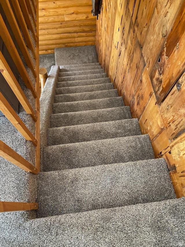 stairs featuring carpet floors