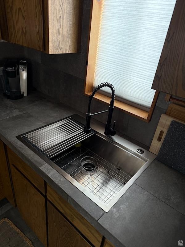 room details with dark countertops and a sink