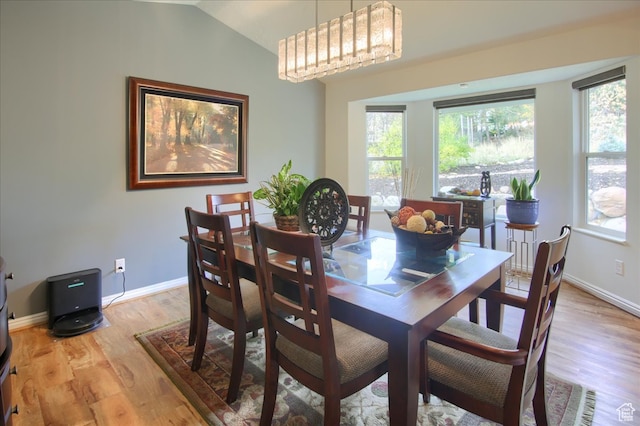 3937 N Patio Springs Dr, Eden, UT 84310 - dining room with light hardwood / wood-style flooring and vaulted ceiling