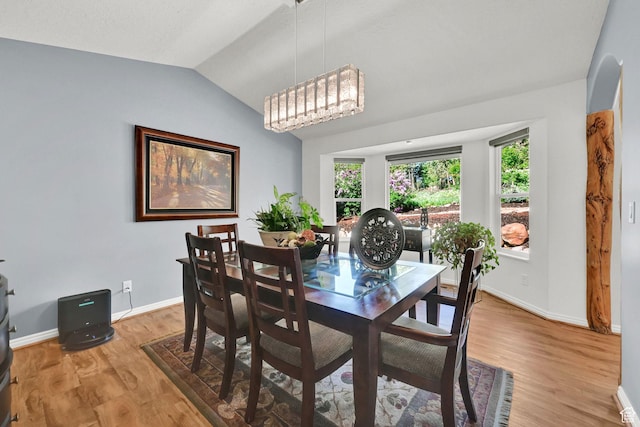 3937 N Patio Springs Dr, Eden, UT 84310 - dining room with lofted ceiling, light wood-style flooring, and baseboards