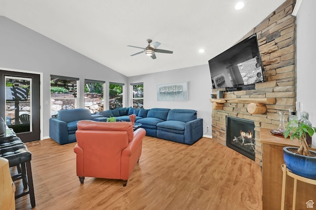 3937 N Patio Springs Dr, Eden, UT 84310 - living room with a stone fireplace, lofted ceiling, a ceiling fan, wood finished floors, and recessed lighting