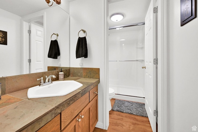 3937 N Patio Springs Dr, Eden, UT 84310 - full bathroom with toilet, a stall shower, vanity, and wood finished floors