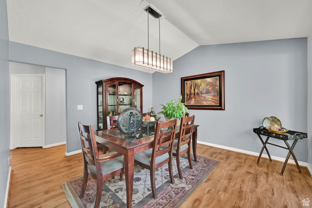 3937 N Patio Springs Dr, Eden, UT 84310 - dining space featuring vaulted ceiling, light wood-type flooring, and baseboards