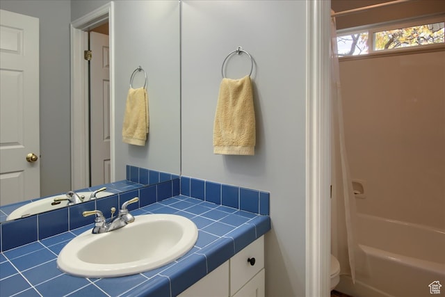 3937 N Patio Springs Dr, Eden, UT 84310 - full bathroom featuring toilet, vanity, and shower / tub combo