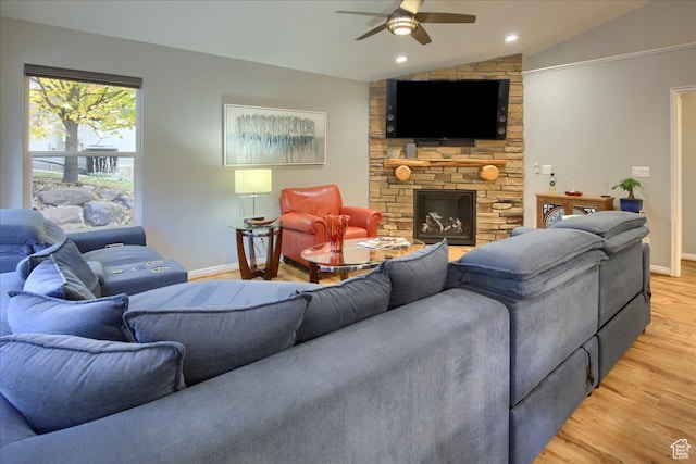 3937 N Patio Springs Dr, Eden, UT 84310 - living room with lofted ceiling, a stone fireplace, light wood-type flooring, and ceiling fan