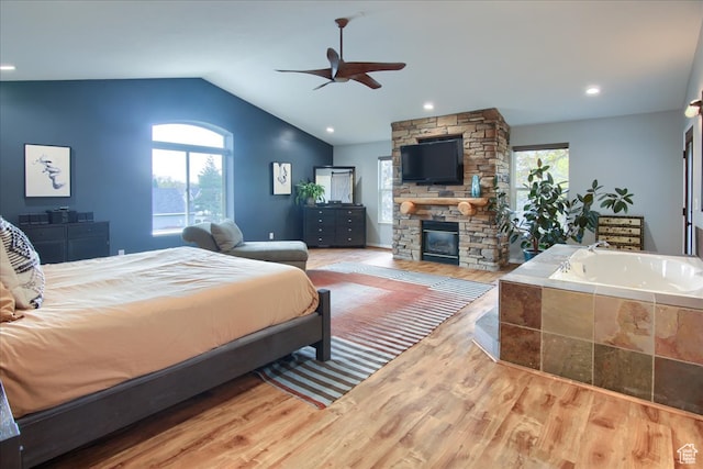 3937 N Patio Springs Dr, Eden, UT 84310 - bedroom featuring ceiling fan, hardwood / wood-style flooring, vaulted ceiling, and a fireplace